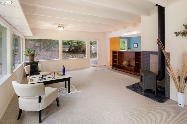 54 W 31st Ave, Eugene, OR 97405 - sunroom / solarium featuring a wood stove, carpet, and beam ceiling