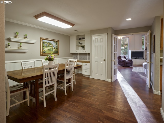 2605 NE 189th St, Ridgefield, WA 98642 - dining space with dark wood finished floors, recessed lighting, visible vents, ornamental molding, and built in study area