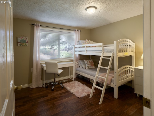 2605 NE 189th St, Ridgefield, WA 98642 - bedroom featuring a textured ceiling, wood finished floors, and baseboards