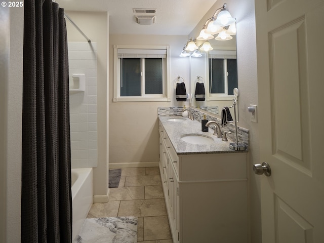 2605 NE 189th St, Ridgefield, WA 98642 - bathroom with shower / tub combo, a sink, baseboards, and double vanity