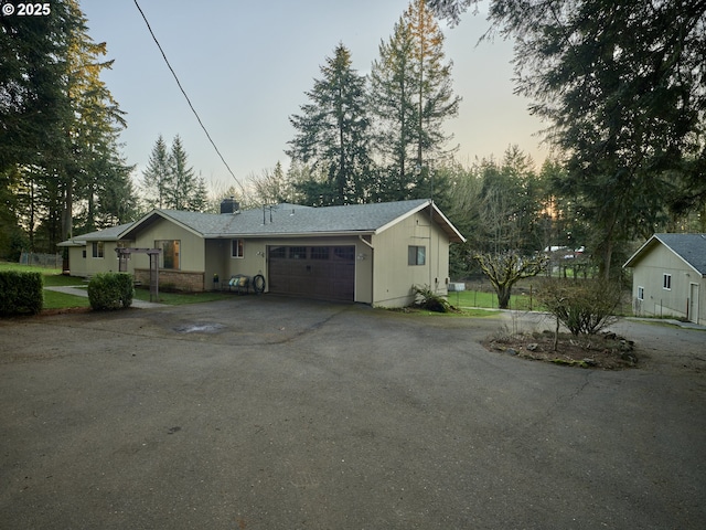 2605 NE 189th St, Ridgefield, WA 98642 - view of front of home with driveway, an attached garage, and fence