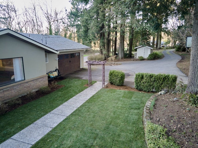 2605 NE 189th St, Ridgefield, WA 98642 - view of yard featuring an outbuilding, driveway, and a shed
