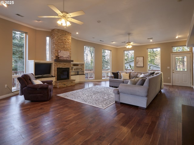 2605 NE 189th St, Ridgefield, WA 98642 - living area with a healthy amount of sunlight, crown molding, and dark wood-style flooring