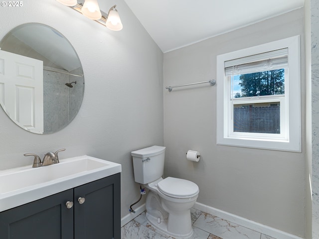 11421 SE Pardee St, Portland, OR 97266 - bathroom featuring toilet, marble look tile flooring, baseboards, vanity, and vaulted ceiling