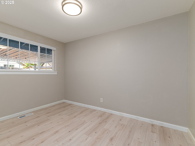 11421 SE Pardee St, Portland, OR 97266 - empty room featuring wood finished floors and baseboards