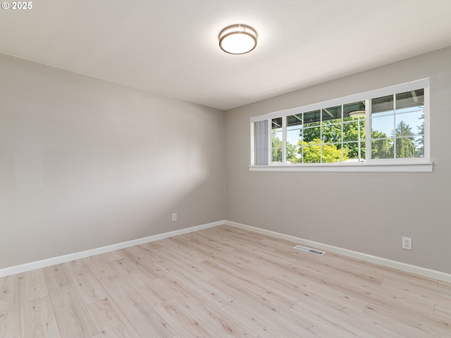 11421 SE Pardee St, Portland, OR 97266 - spare room featuring wood finished floors and baseboards