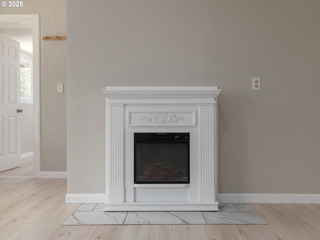 11421 SE Pardee St, Portland, OR 97266 - detailed view of wood finished floors, a fireplace, and baseboards