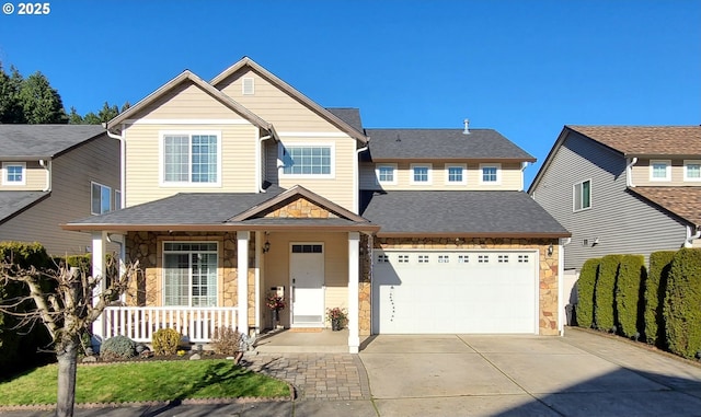 view of front of property with covered porch and a garage