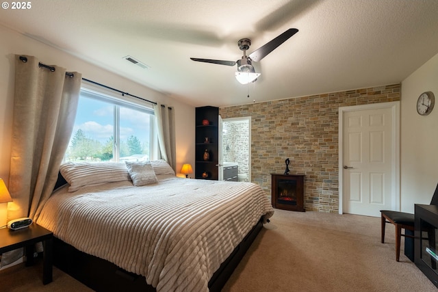 bedroom featuring ceiling fan and carpet