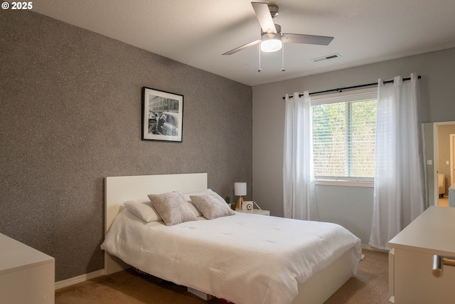 carpeted bedroom featuring ceiling fan