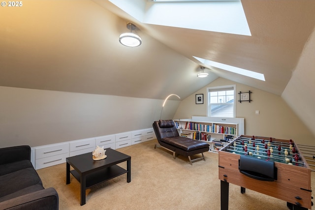 recreation room featuring light carpet and lofted ceiling with skylight