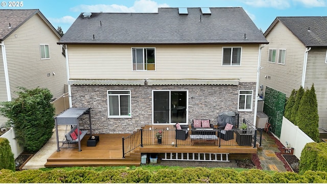 rear view of property featuring central AC unit, outdoor lounge area, and a wooden deck