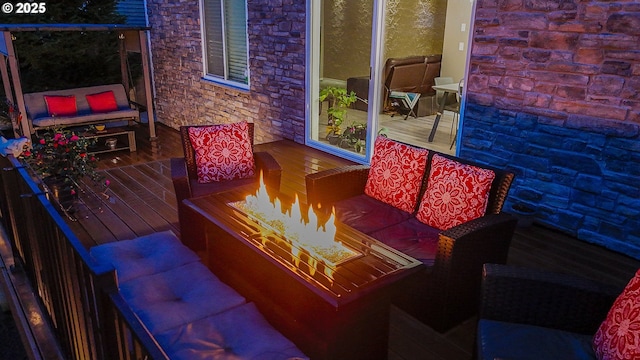 wooden terrace with an outdoor fire pit