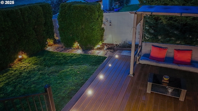 wooden deck featuring a yard