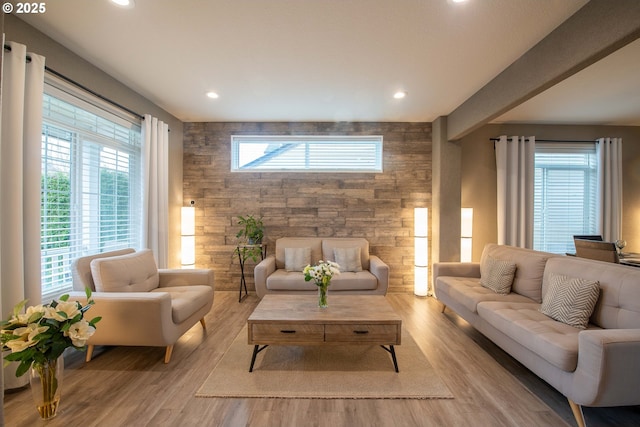 living room with light hardwood / wood-style flooring and a wealth of natural light