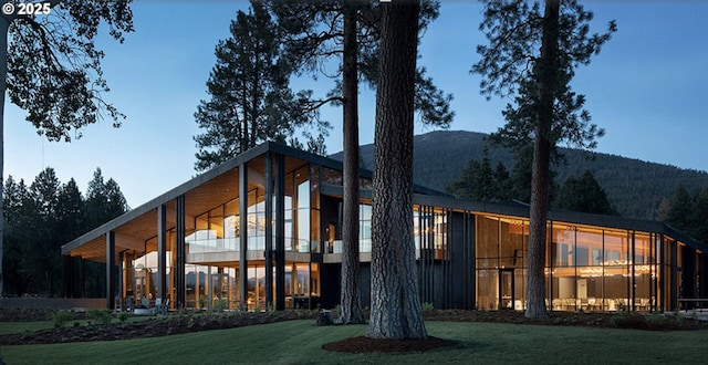 14023 Hawks Beard Unit Gm164, Black Butte Ranch, OR 97759 - back of property featuring a mountain view and a lawn