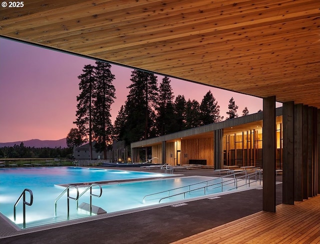 14023 Hawks Beard Unit Gm164, Black Butte Ranch, OR 97759 - pool at dusk with a community pool, a patio, and a mountain view