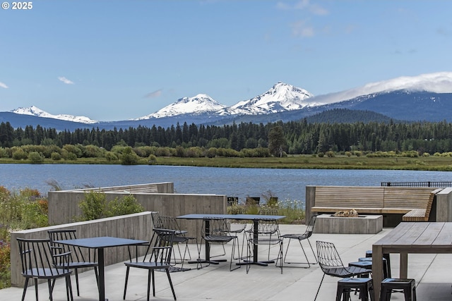 14023 Hawks Beard Unit Gm164, Black Butte Ranch, OR 97759 - wooden deck with a wooded view, a water and mountain view, and outdoor dining space
