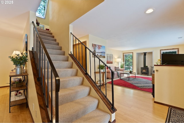14023 Hawks Beard Unit Gm164, Black Butte Ranch, OR 97759 - staircase with a wood stove, wood finished floors, baseboards, and recessed lighting
