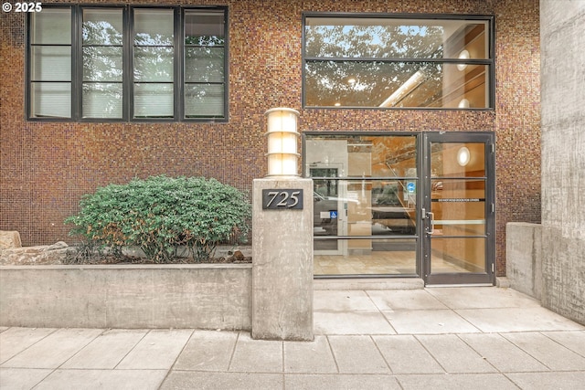 725 NW 10th Ave Unit 303, Portland, OR 97209 - doorway to property featuring brick siding