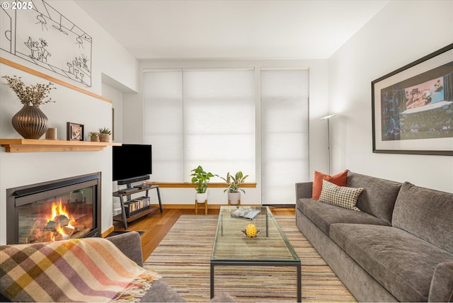725 NW 10th Ave Unit 303, Portland, OR 97209 - living area with a glass covered fireplace and wood finished floors