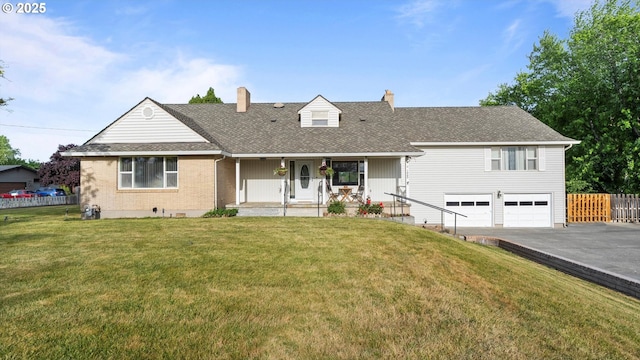 1060 SW 7th St, Hermiston, OR 97838 - view of front of property featuring a chimney, driveway, a porch, and a garage
