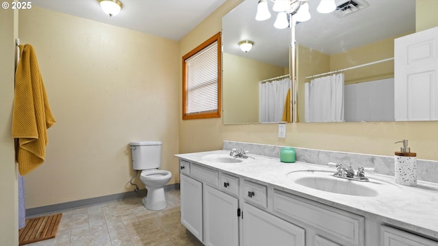 1060 SW 7th St, Hermiston, OR 97838 - bathroom featuring toilet, baseboards, double vanity, and a shower with shower curtain