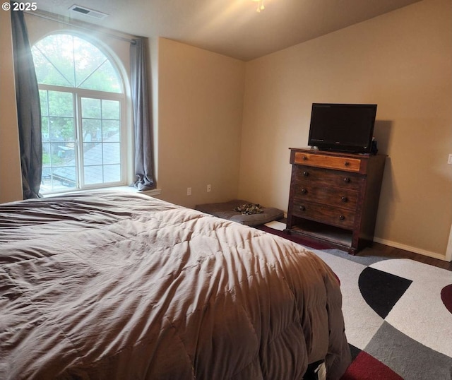 bedroom featuring visible vents and baseboards