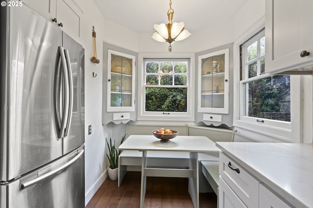 1710 SE 42nd Ave, Portland, OR 97215 - kitchen with freestanding refrigerator, baseboards, dark wood finished floors, light countertops, and glass insert cabinets