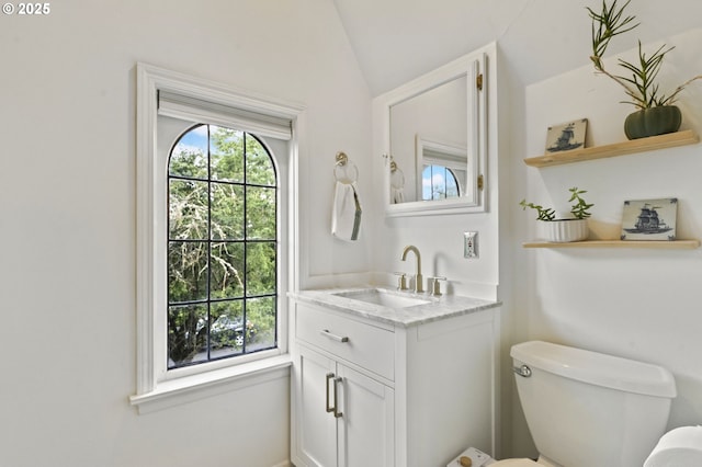 1710 SE 42nd Ave, Portland, OR 97215 - half bathroom with toilet, vanity, and vaulted ceiling
