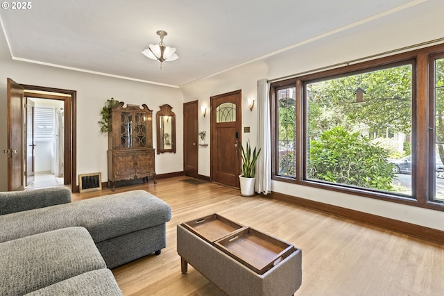 1710 SE 42nd Ave, Portland, OR 97215 - living room with light wood-style floors, baseboards, and ornamental molding