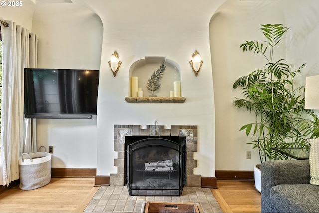 1710 SE 42nd Ave, Portland, OR 97215 - living area featuring wood finished floors, a tiled fireplace, and baseboards