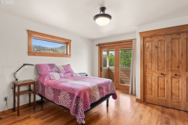 702 B Ave, La Grande, OR 97850 - bedroom with access to outside and light wood-style floors