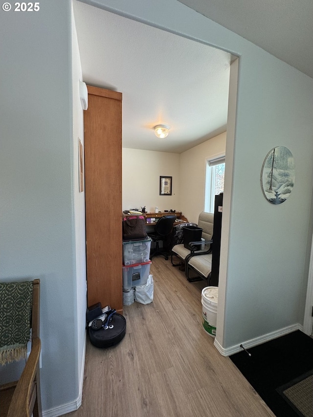 hallway featuring light hardwood / wood-style flooring