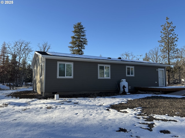 view of snow covered house