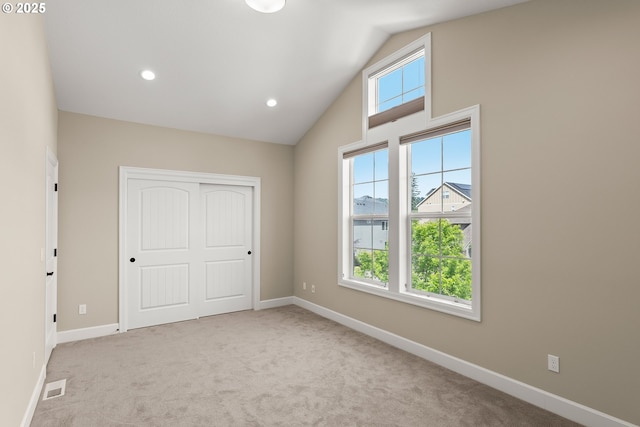 15430 NW Delia St, Portland, OR 97229 - unfurnished bedroom with carpet flooring, baseboards, a closet, recessed lighting, and high vaulted ceiling