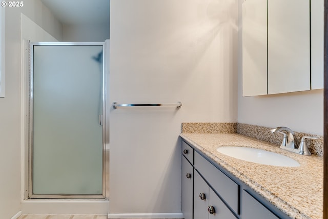 full bathroom featuring vanity and a stall shower