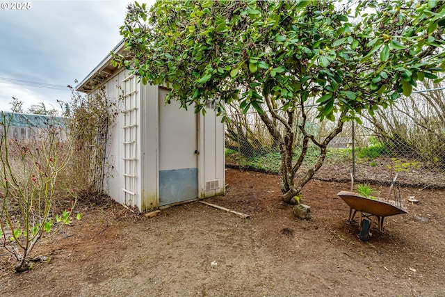 view of shed with fence