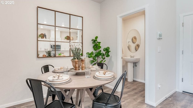 3422 SW Hartley Ave, Gresham, OR 97080 - dining space featuring wood finished floors and baseboards