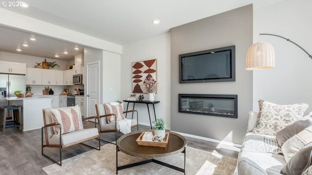 3422 SW Hartley Ave, Gresham, OR 97080 - living area featuring light wood-style floors, recessed lighting, and a glass covered fireplace