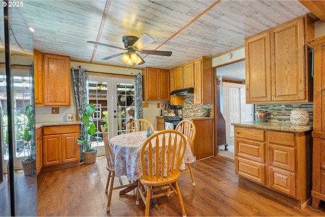 12785 Sutherland Rd, Swisshome, OR 97480 - dining room with french doors, ceiling fan, plenty of natural light, and wood ceiling
