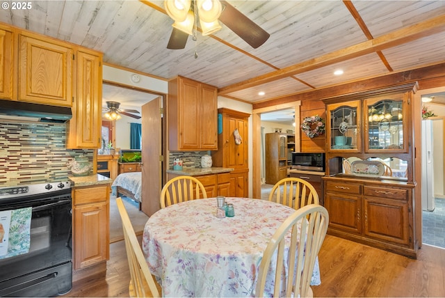 12785 Sutherland Rd, Swisshome, OR 97480 - dining space featuring a ceiling fan, wooden ceiling, and light wood-style flooring
