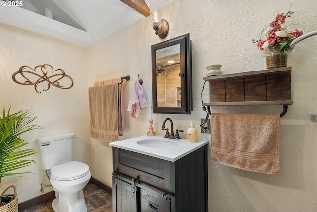 12785 Sutherland Rd, Swisshome, OR 97480 - bathroom featuring vanity, toilet, lofted ceiling, and baseboards