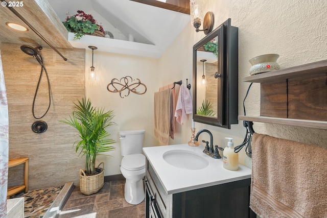 12785 Sutherland Rd, Swisshome, OR 97480 - full bathroom featuring stone tile floors, vanity, toilet, tiled shower, and lofted ceiling