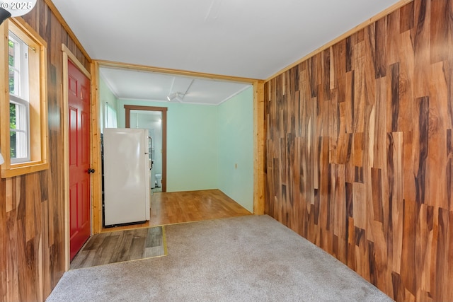 12785 Sutherland Rd, Swisshome, OR 97480 - empty room featuring carpet floors and wood walls