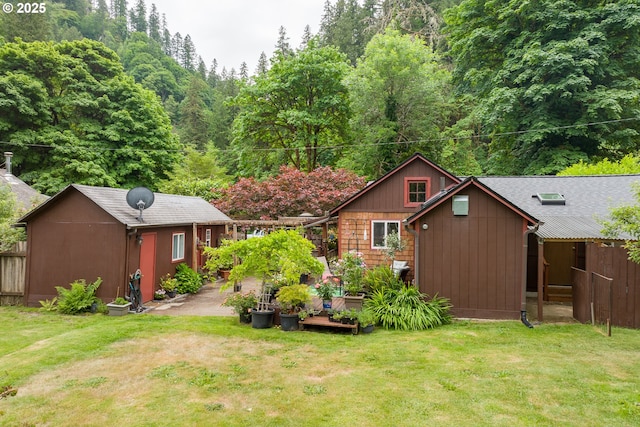 12785 Sutherland Rd, Swisshome, OR 97480 - view of green lawn featuring an outbuilding