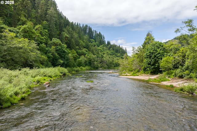 12785 Sutherland Rd, Swisshome, OR 97480 - water view with a heavily wooded area