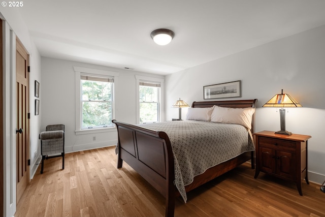 12624 SW 22nd Ave, Lake Oswego, OR 97034 - bedroom featuring light wood-style flooring and baseboards