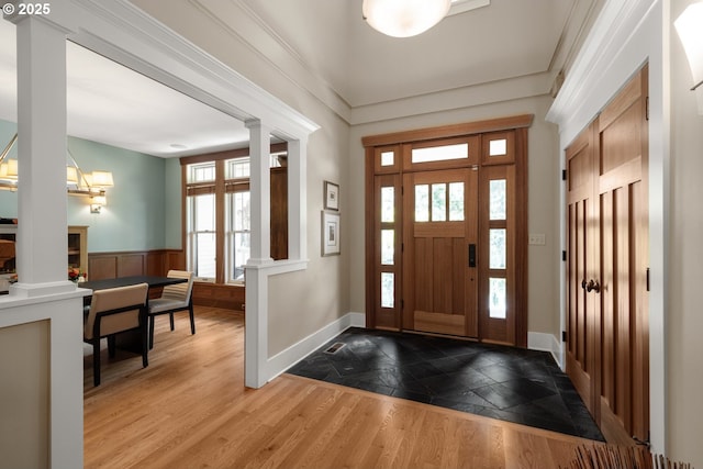 12624 SW 22nd Ave, Lake Oswego, OR 97034 - entryway with ornate columns, stone tile floors, and a wainscoted wall