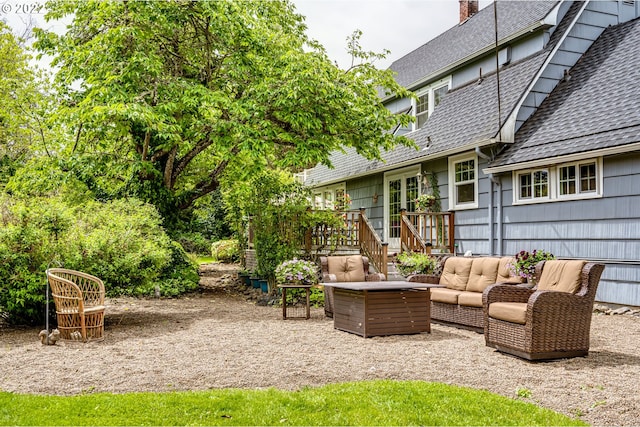 exterior space with an outdoor living space, french doors, and a wooden deck